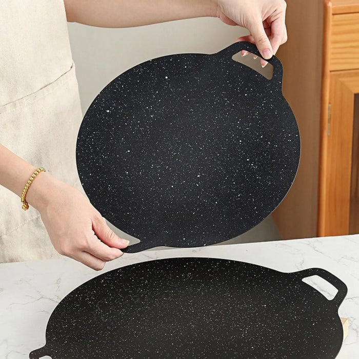 Poêle de cuisson en pierre anti-adhésive extérieure – idéale pour le camping ou la cuisson nomade.