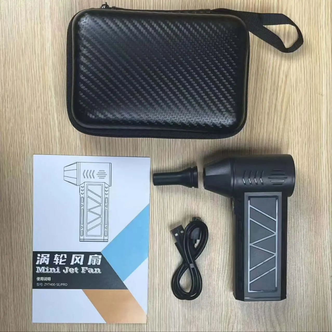 Portable high-power camping blower with LED lights, shown with accessory case, USB cable, and manual, ideal for drying tents and awnings.