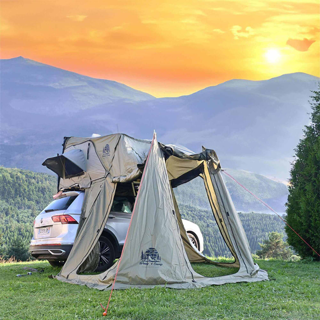 Roof tent annex attached to SUV with scenic mountain sunset view, highlighting spacious outdoor setup for 2-3 people.