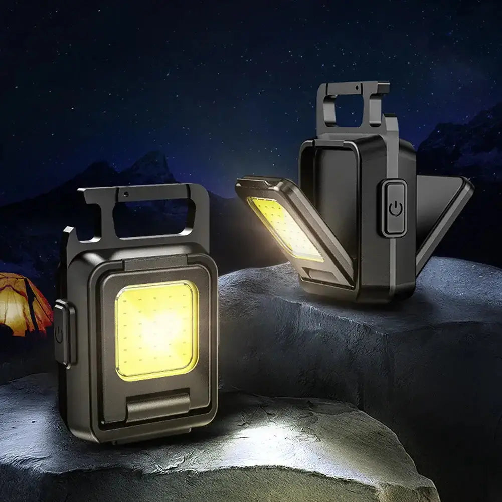 Mini Lampe de Poche ultrapuissante LED on rocky surface at night, showing bright light output, ideal for outdoor adventures.