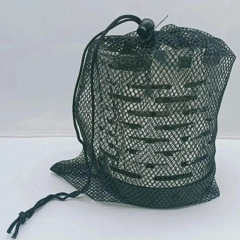 Portable steel gas heater in mesh bag, ideal for camping and outdoor activities, providing warm comfort in a compact design.