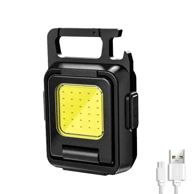 Mini Lampe de Poche ultrapuissante LED noire avec chargeur USB inclus, idéale pour l'éclairage d'aventure et d'urgence.