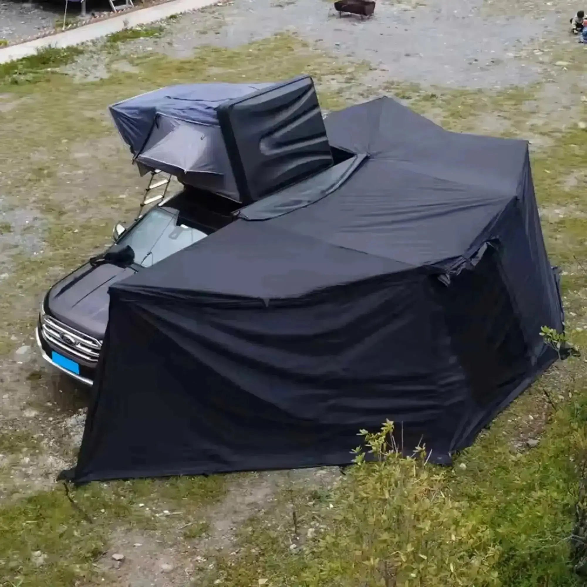 Self-supporting 360° awning with LEDs, attached to a van, providing shade and coverage for camping outdoors.