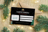Carte cadeau de 50€ pour une tente de toit et des accessoires de camping, enveloppe décorative, branches de sapin en arrière-plan, offre spéciale.