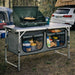 cuisine de camping pliante, meuble cuisine camping, table camping avec rangement, armoire camping pliable, cuisine outdoor portable, table de camping aluminium, meuble vanlife cuisine, équipement camping cuisine, table barbecue extérieure