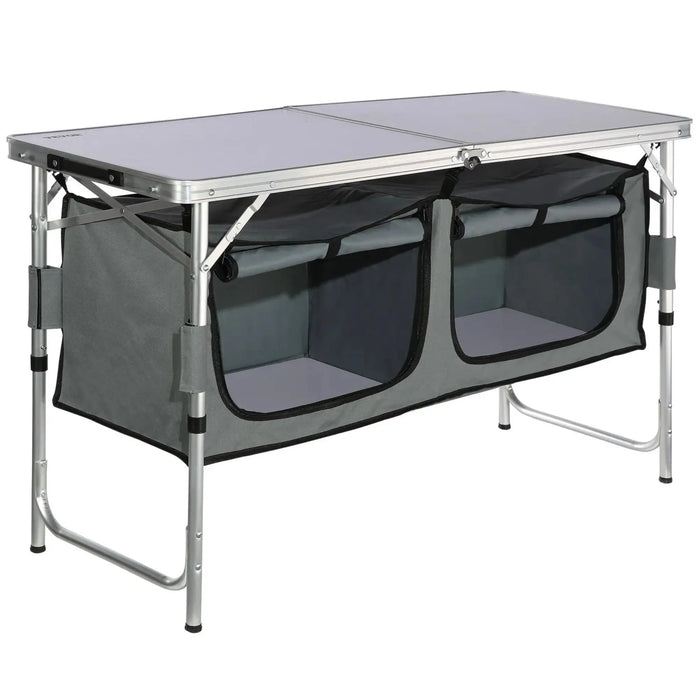 cuisine de camping pliante, meuble cuisine camping, table camping avec rangement, armoire camping pliable, cuisine outdoor portable, table de camping aluminium, meuble vanlife cuisine, équipement camping cuisine, table barbecue extérieure