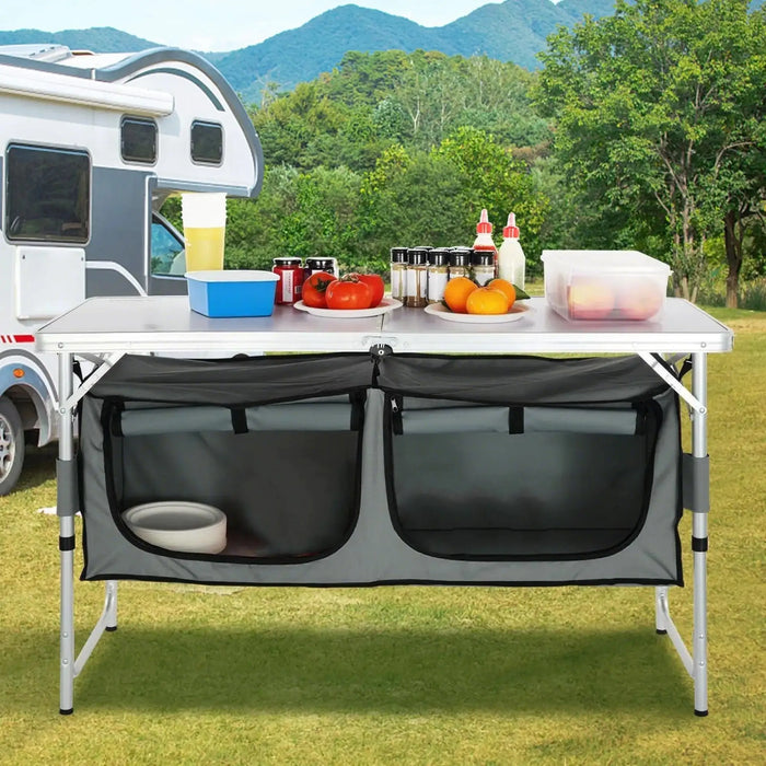 cuisine de camping pliante, meuble cuisine camping, table camping avec rangement, armoire camping pliable, cuisine outdoor portable, table de camping aluminium, meuble vanlife cuisine, équipement camping cuisine, table barbecue extérieure