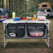 cuisine de camping pliante, meuble cuisine camping, table camping avec rangement, armoire camping pliable, cuisine outdoor portable, table de camping aluminium, meuble vanlife cuisine, équipement camping cuisine, table barbecue extérieure
