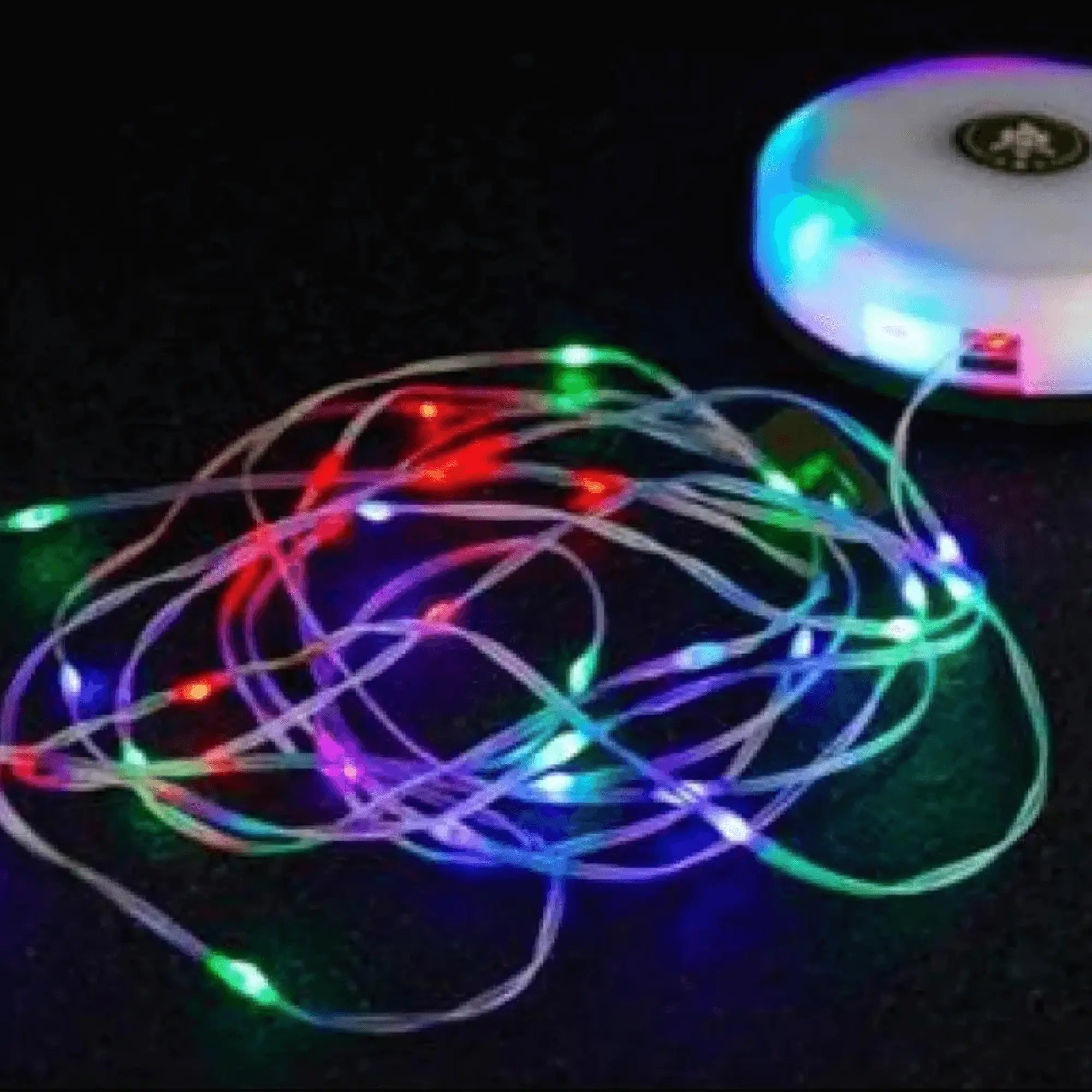 Colorful portable LED string lights on a dark background