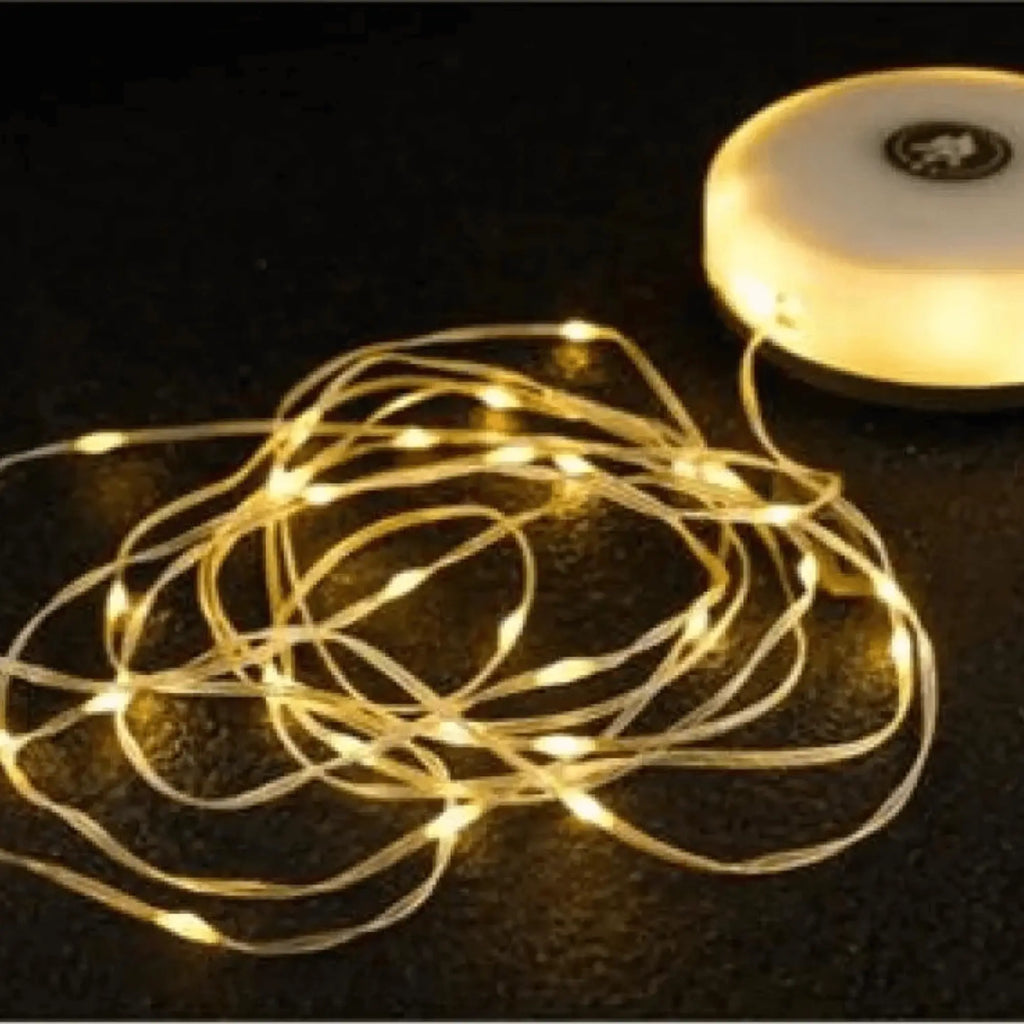 Portable waterproof string lights with warm glow, compact design, ideal for camping and outdoor gatherings, easy to deploy with crank.
