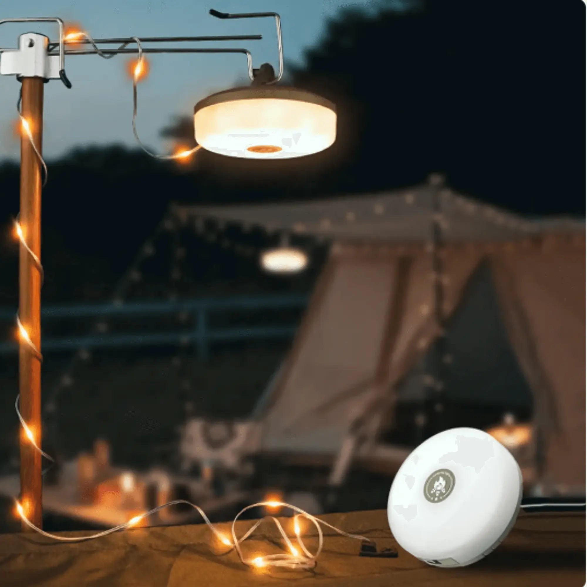 Portable waterproof string lights with crank for outdoor camping decoration, illuminating a tent with warm, cozy glow.