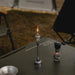 Lampe de camping rechargeable à gaz pour table en plein air, offrant un éclairage chaleureux pour des soirées en pleine nature.