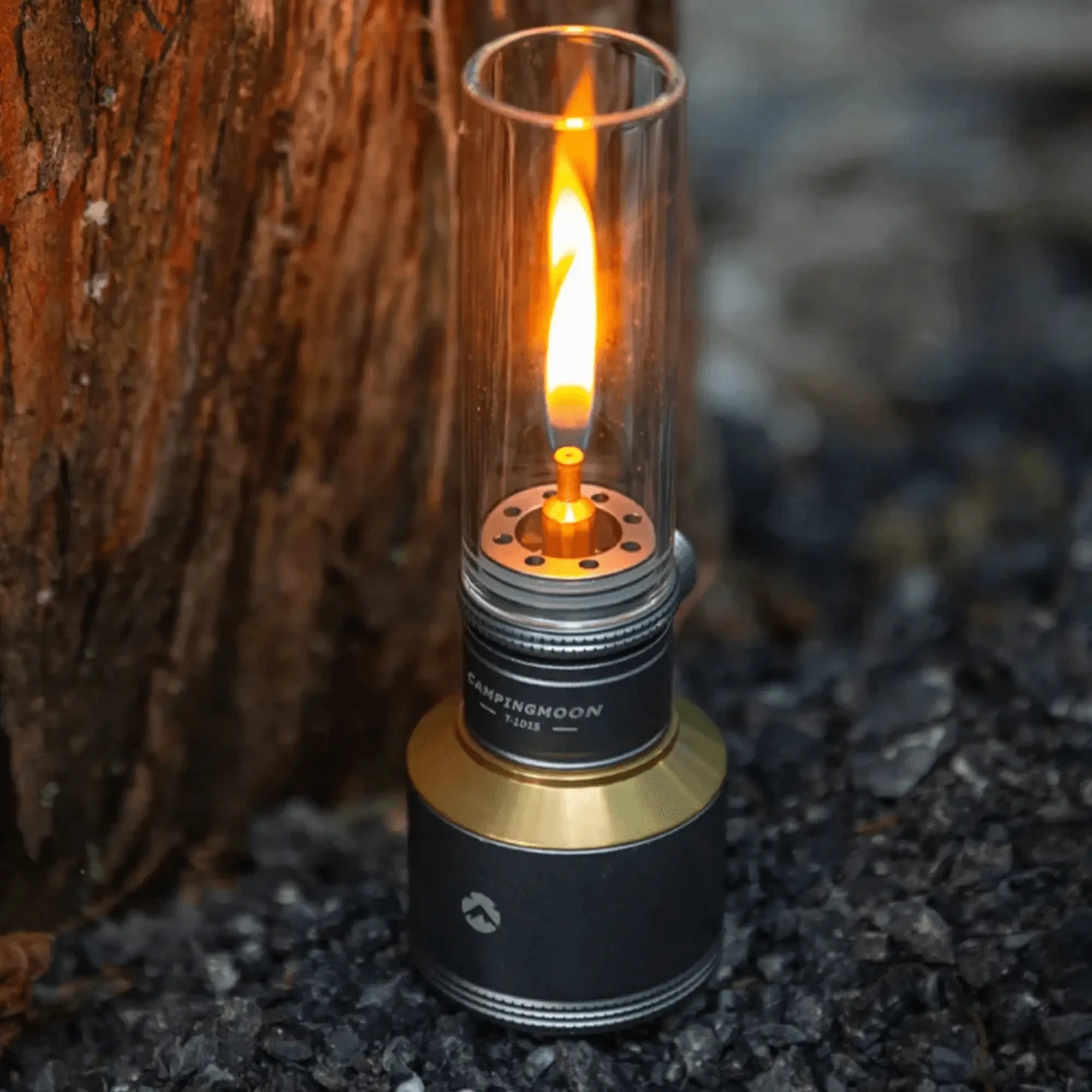Rechargeable gas camping lantern providing warm light, perfect for outdoor adventures like hiking and camping, set against a natural background.