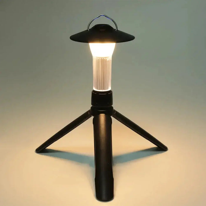 Lanternes solaires rechargeables multifonctionnelles avec lumière LED et design de trépied, idéales pour les aventures en plein air et l'éclairage.