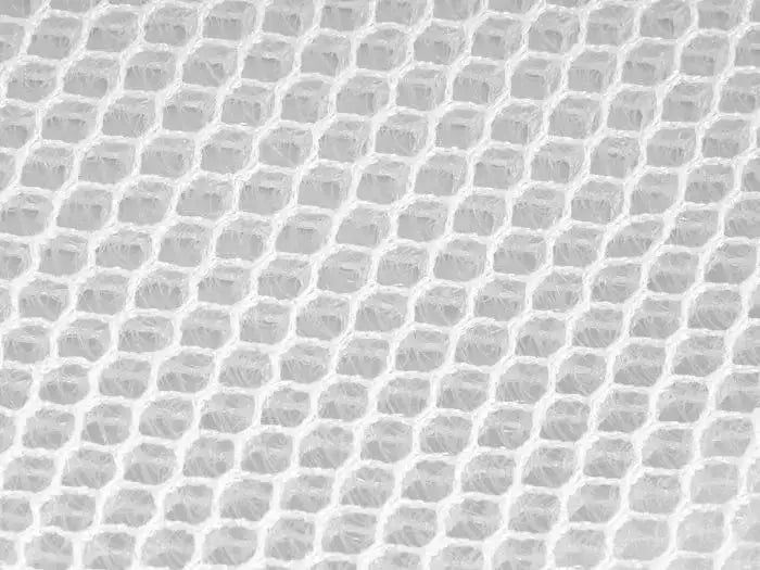 Close-up of breathable bamboo fiber texture for anti-condensation mattress used in rooftop tents.