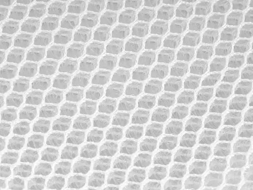 Gros plan sur la texture de la fibre de bambou respirante pour un matelas anti-condensation utilisé dans les tentes de toit.