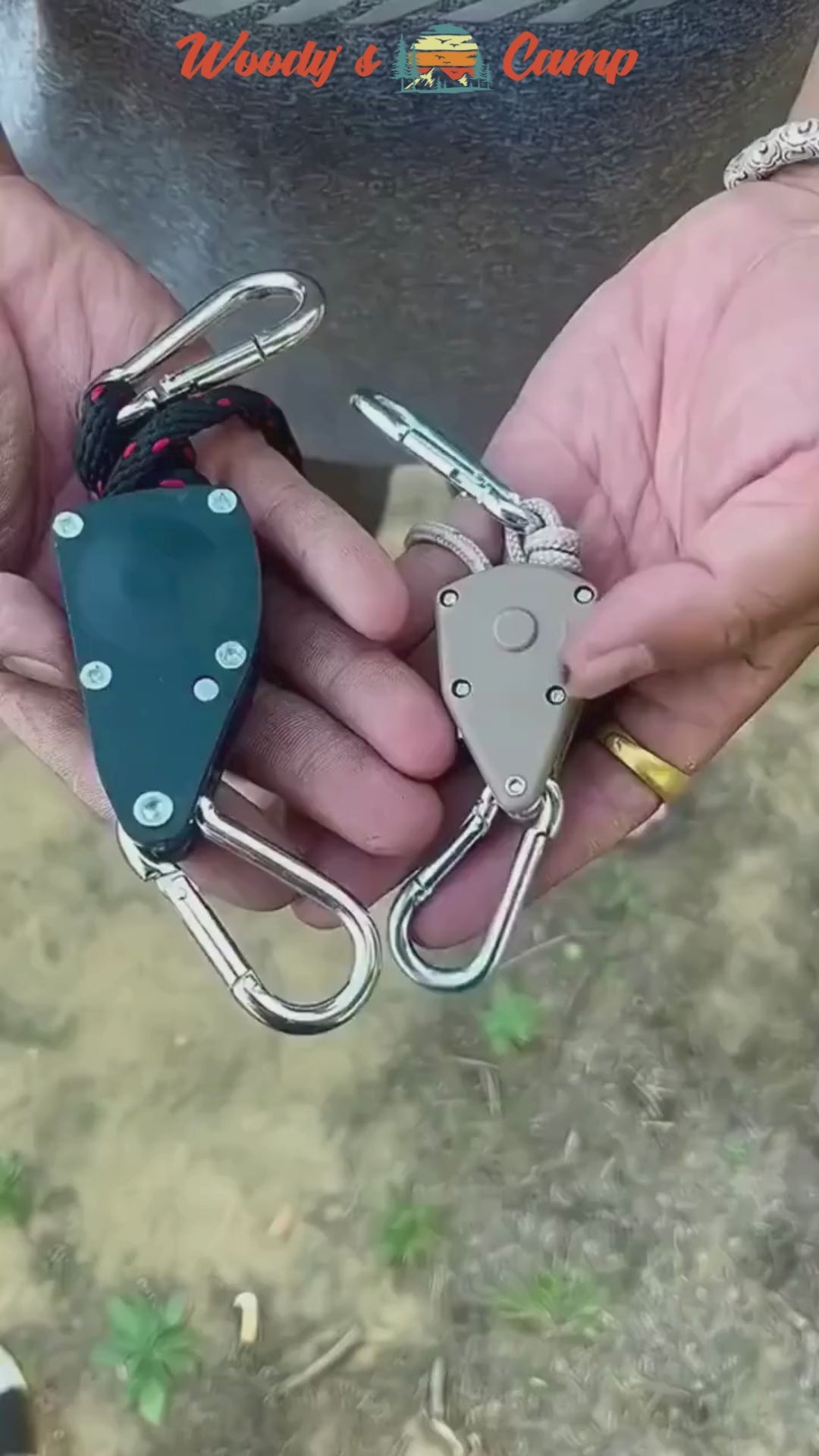 Person holding Serre-Corde Anti-Vent with pulley, two units shown, ideal for camping and outdoor use for tent stability.