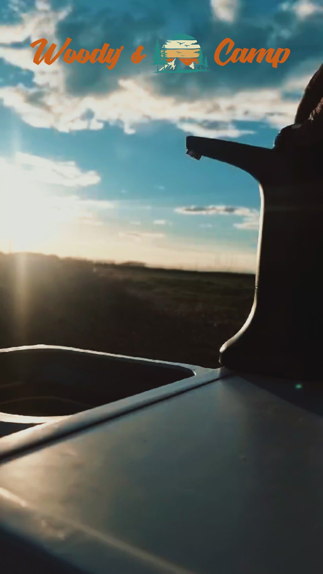 Silhouette of a camping electric faucet against a sunset, perfect for outdoor adventurers and van life enthusiasts.
