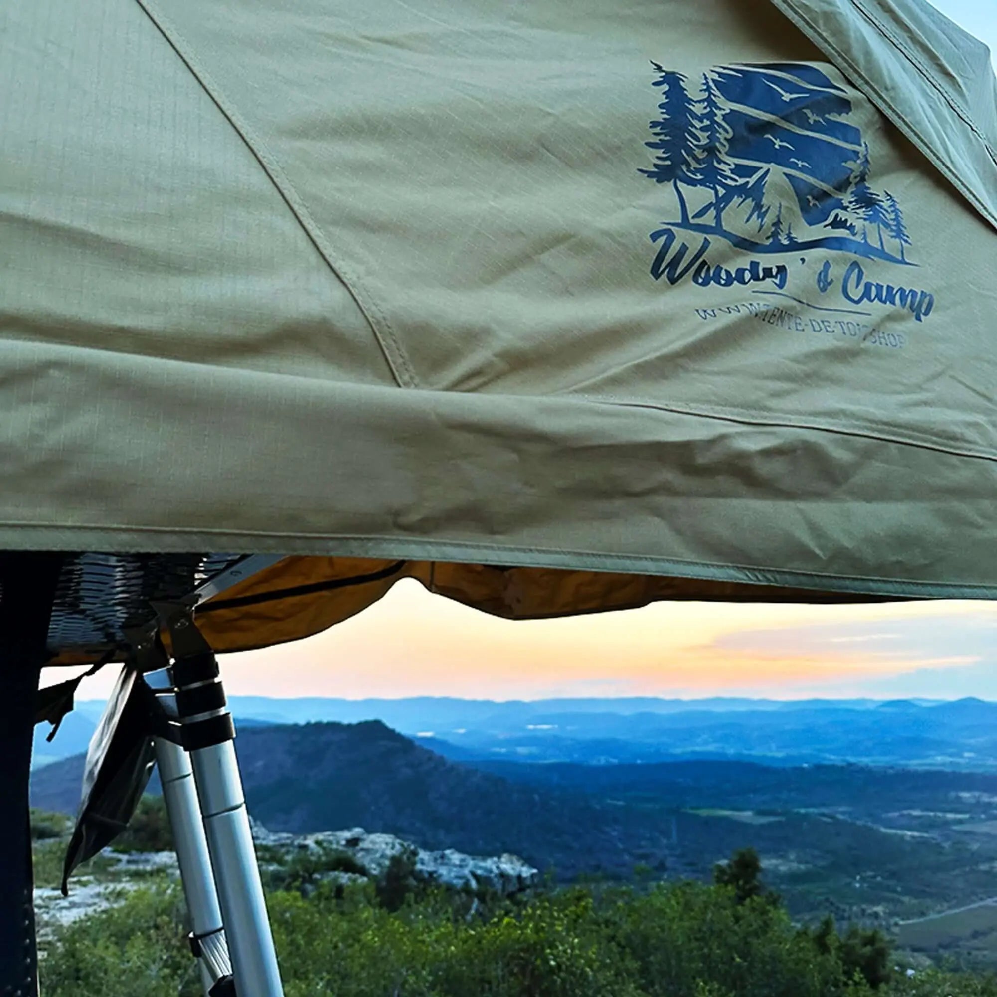Camping tent roof with scenic mountain and sunset view, ideal for family adventures, offering comfort for 4-5 people.