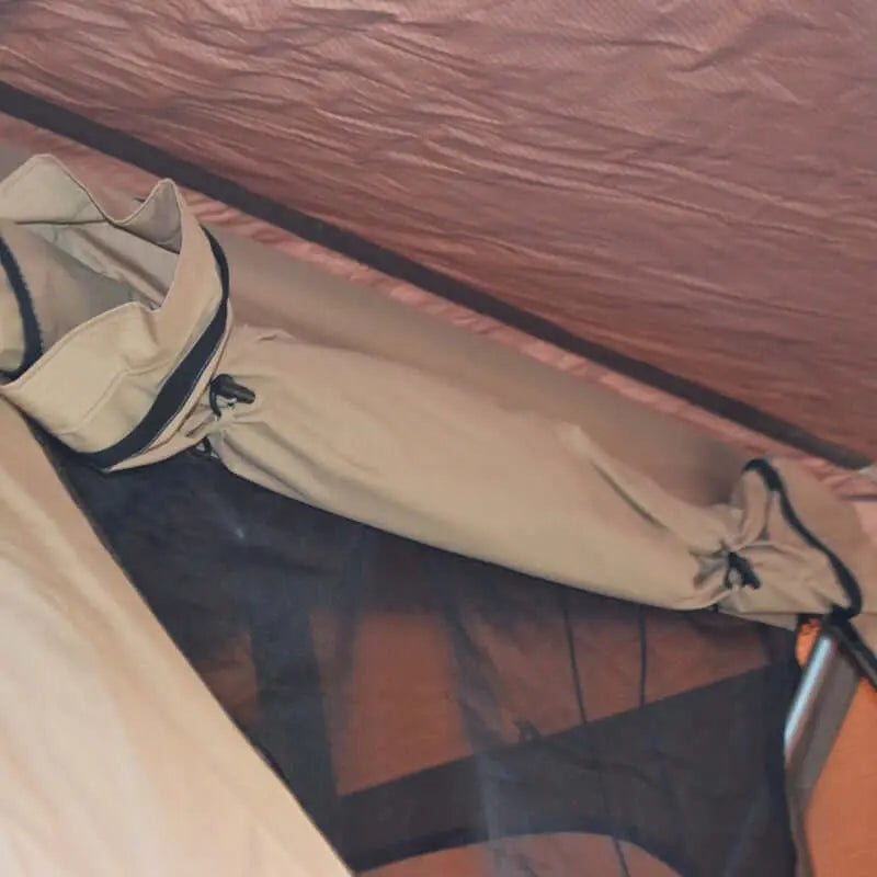 Interior view of soft rooftop tent for 4-5 people, showcasing its spacious design and durable fabric, perfect for family camping.