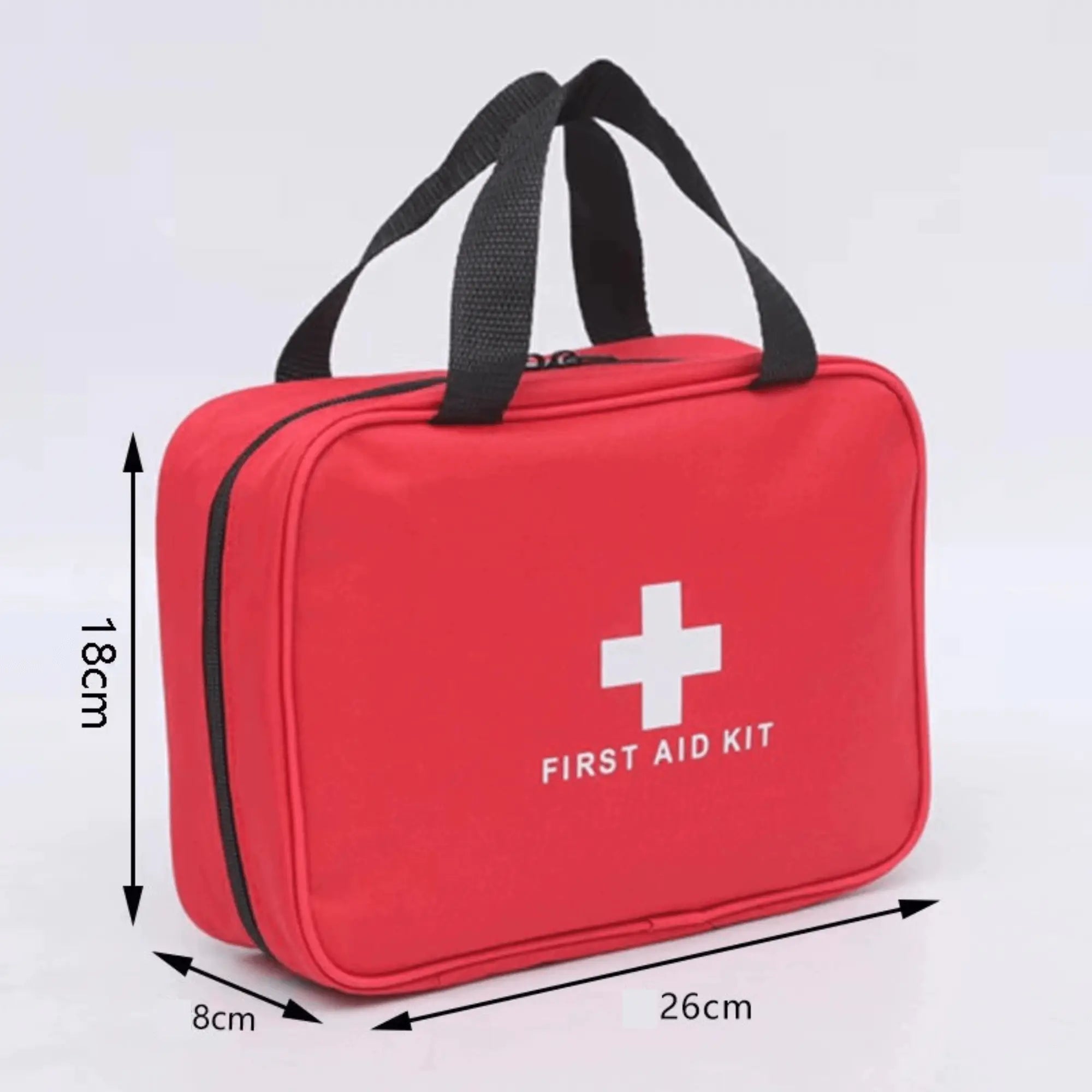Compact red first aid kit with black handles, ideal for camping and travel, dimensions 26cm x 18cm x 8cm, featuring white cross logo.
