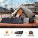 Station électrique portable de 1200W avec deux panneaux solaires de 100W installés à l'extérieur à côté d'une tente.