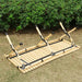 louer materiel camping table chaise montpellier location herault 34000 woodys camp Table de camping en bois pliable installée en extérieur avec des chaises, des boissons et de la nourriture, mettant en avant un design durable pour des repas confortables en plein air.