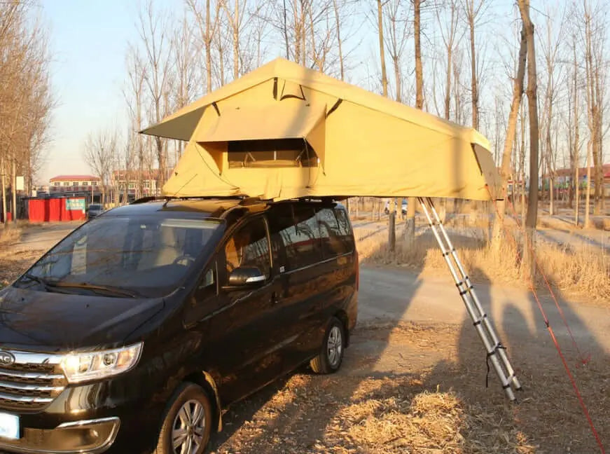 Soft rooftop tent for 2-3 people mounted on a black SUV in a nature setting, ideal for camping adventures with family or friends.