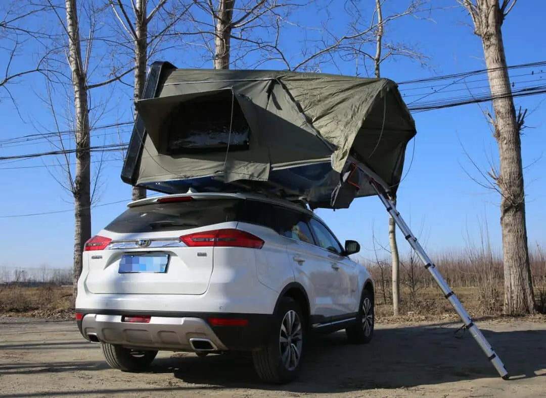 Vehicle with a rooftop tent for 2-3 people, perfect for camping adventures in nature.